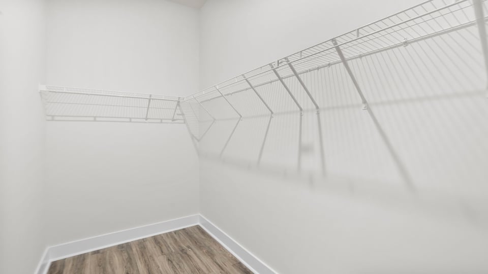 Closet with hanging storage racks.