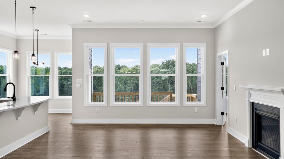 Living room with windows and fireplace.