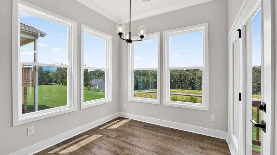 Sunroom with large windows.