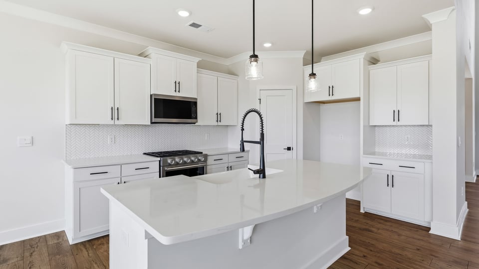 Kitchen and island with granite countertops.