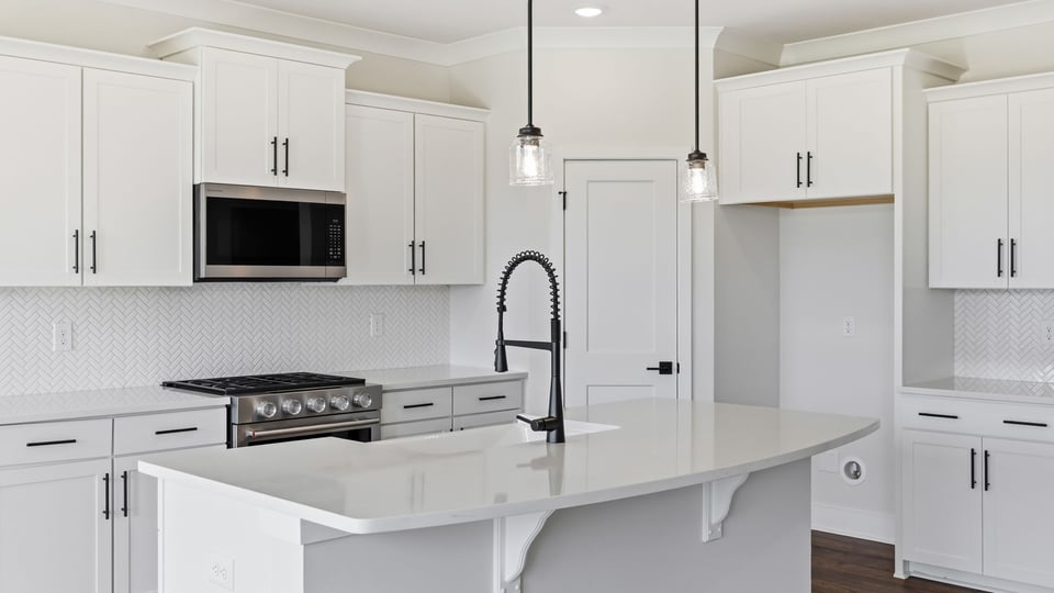 Kitchen and island with granite countertops.