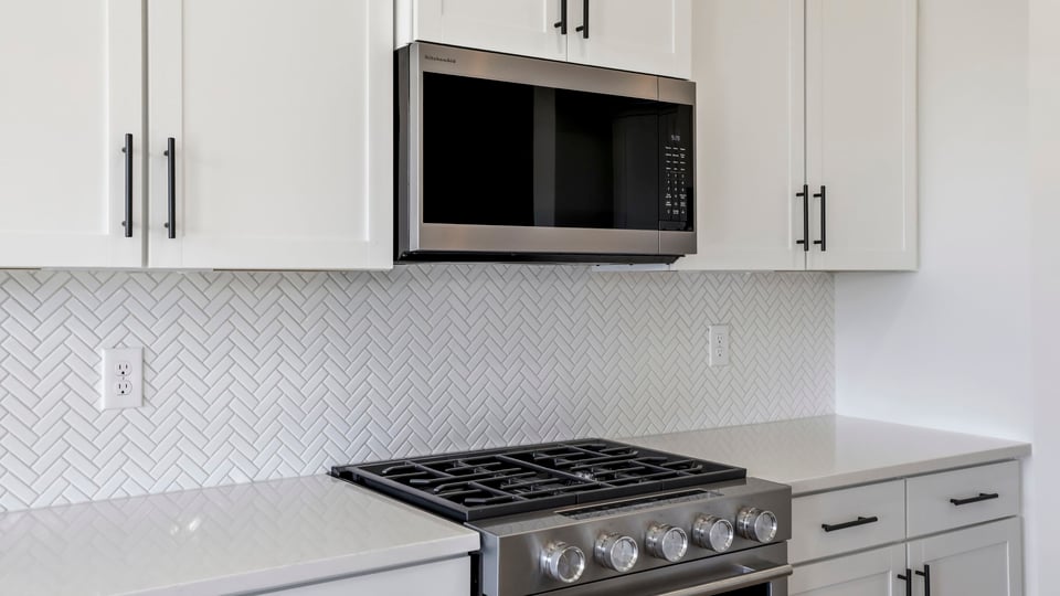 Kitchen and island with granite countertops.