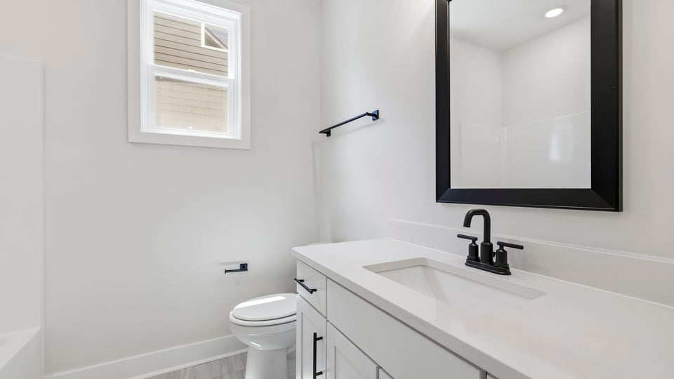 Bathroom with single vanity sink and shower.