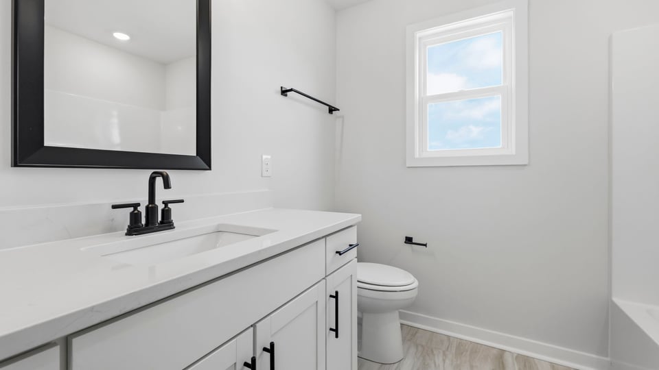 Bathroom with single vanity sink.