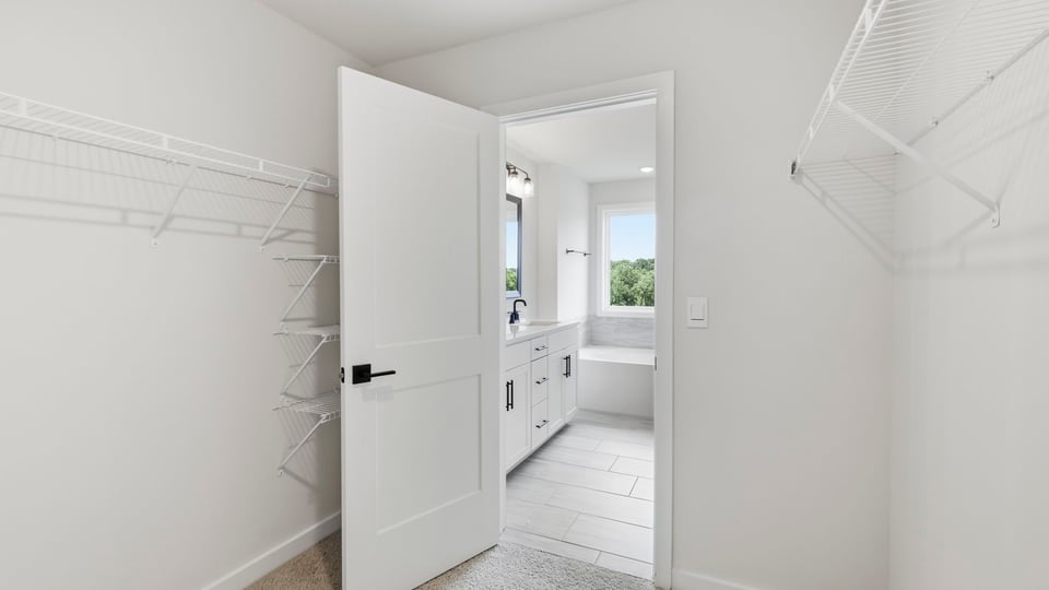 Closet with hanging storage racks.