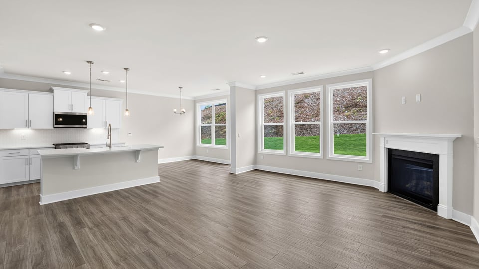 Living room with windows and fireplace.