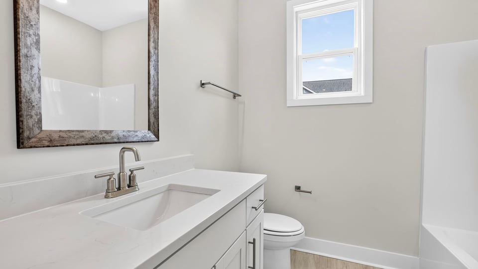 Bathroom with single vanity sink and shower.