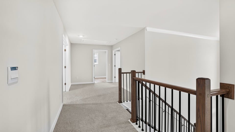 Loft area with carpet.