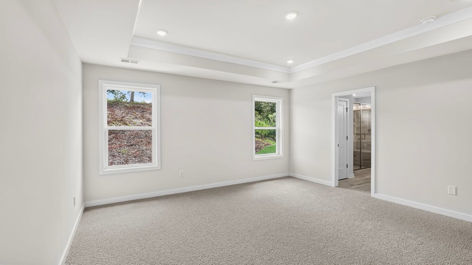 Bedroom with carpet and window.