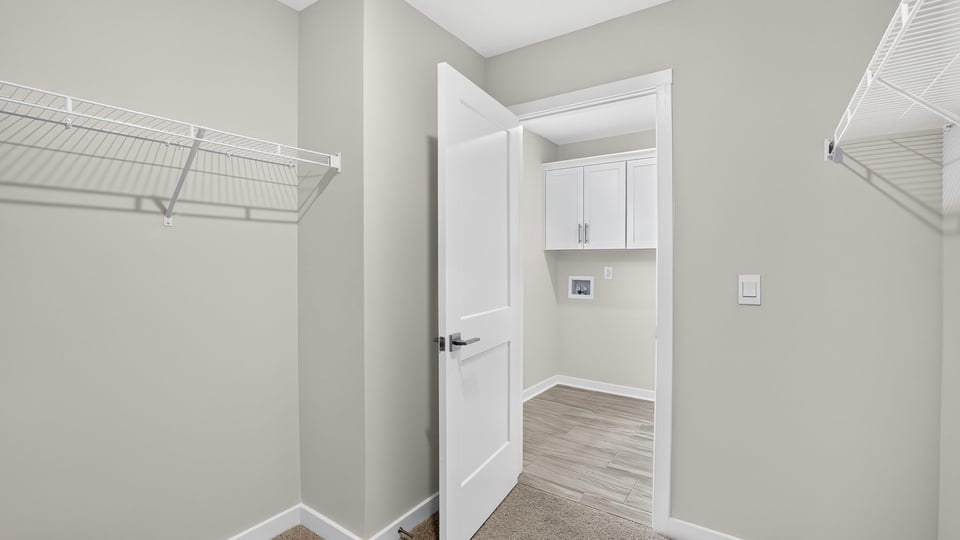 Closet with hanging storage racks.