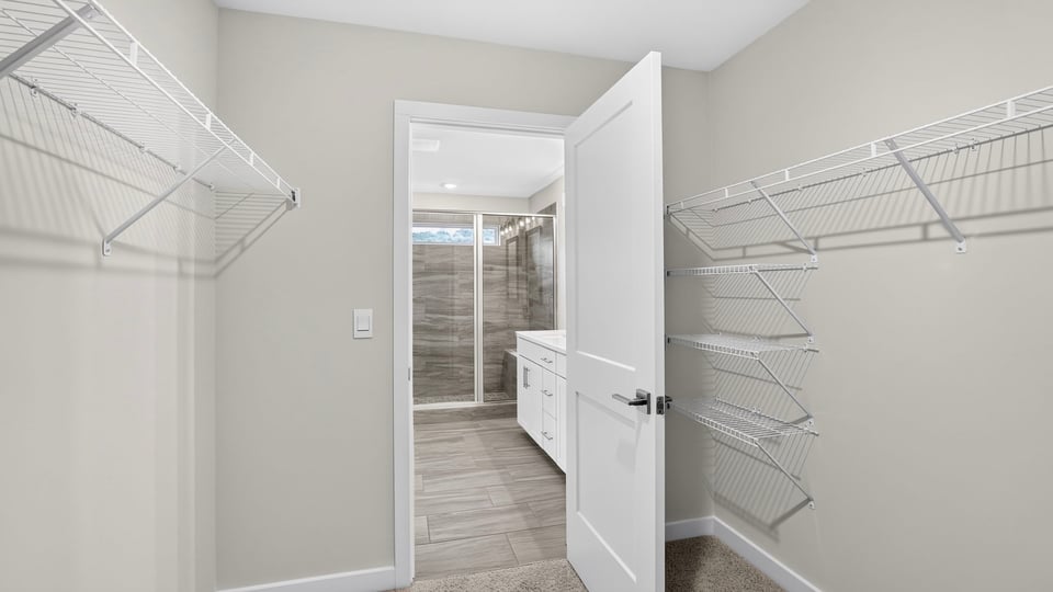 Closet with hanging storage racks.