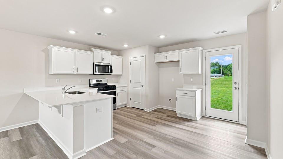 Kitchen with stainless steel appliances.