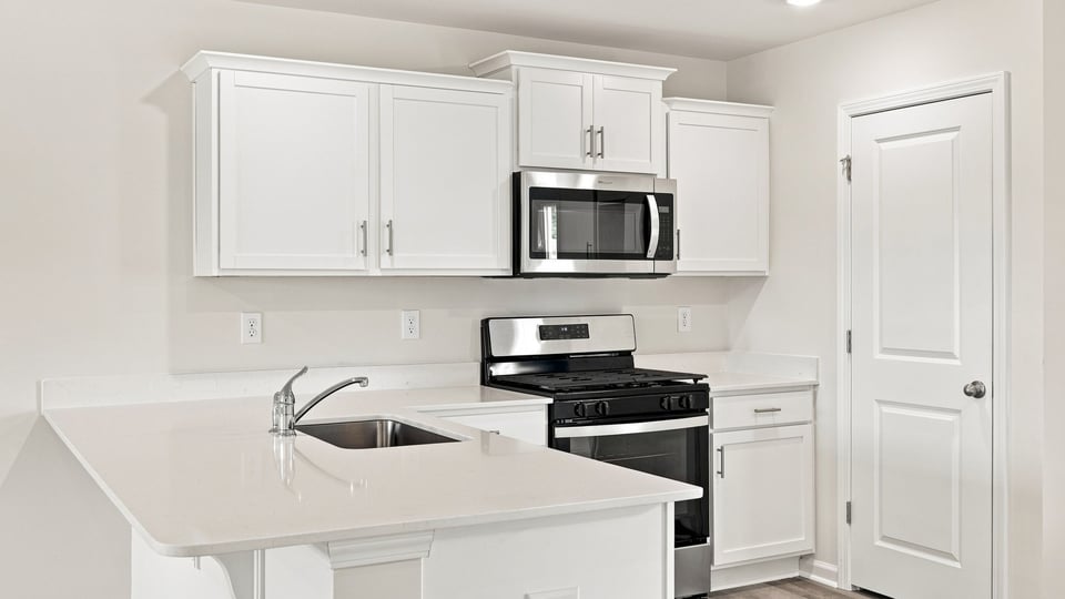 Kitchen with stainless steel appliances.