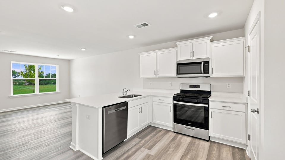 Kitchen with stainless steel appliances.