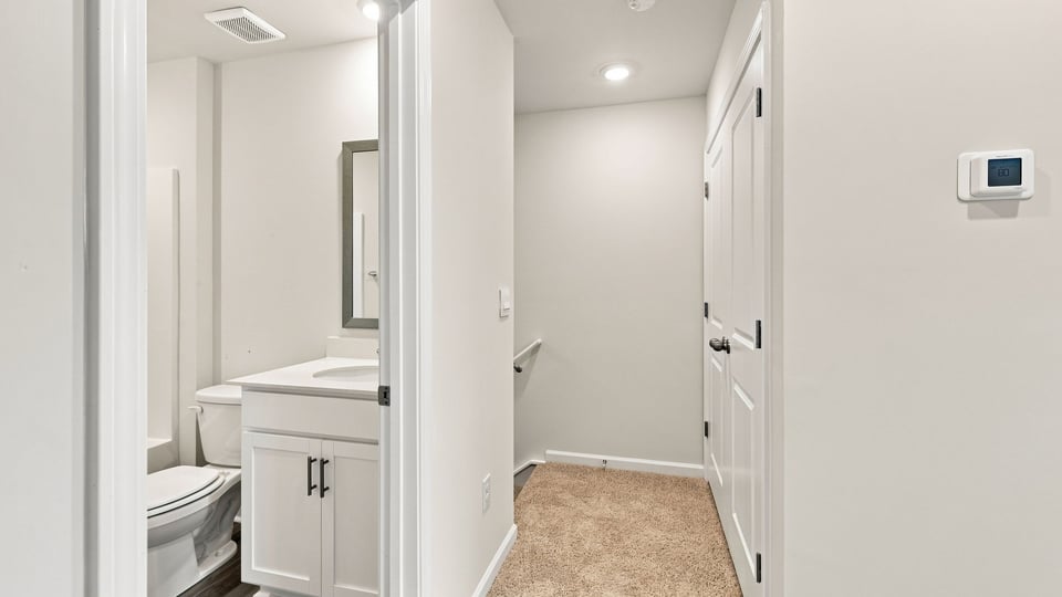Hallway view of bedrooms.