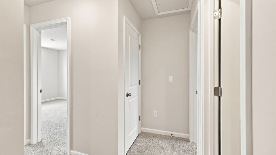 Bedroom with carpet and window.