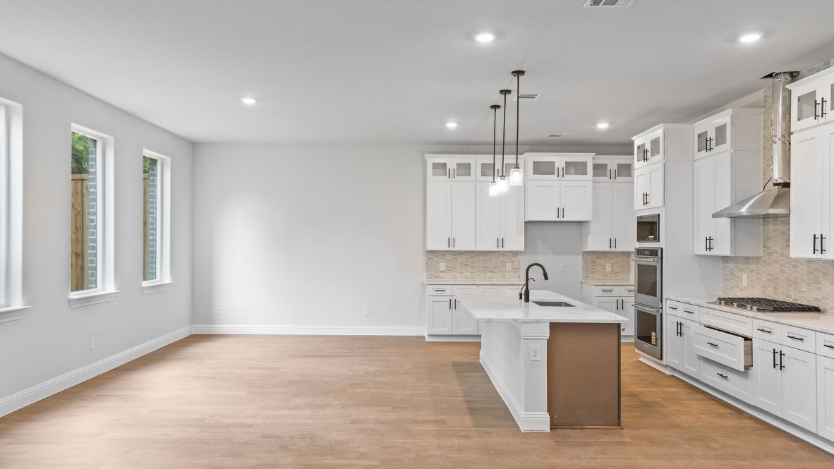 Open concept first floor with the living room, dining room and kitchen next to each other