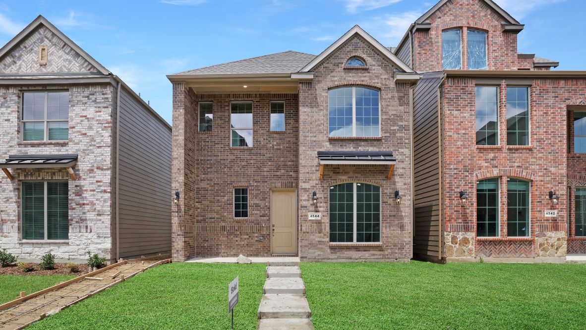 Discover the Lariat Floor Plan at The Avenue in Allen, TX  Welcome to the Lariat, a stunning 3-bedroom, 3.5-bathroom, 2-story home offering 1,614 sq. ft. of modern living space. As you arrive, the timeless exterior with brick detailing, large windows, and a charming front porch creates an inviting curb appeal. Situated in The Avenue, a master-planned, mixed-use community, this home features a rear-entry garage and a beautiful greenway-facing front yard, blending urban convenience with a serene neighborhood feel.  Step inside and be greeted by an open-concept living space, where natural light pours through large windows, enhancing the sleek picture-frame cabinetry, stainless steel appliances, and quartz or granite countertops in the chef-inspired kitchen. A private guest suite on the main level provides flexibility, while the second floor boasts a luxurious primary suite with a walk-in closet, spa-like en-suite bath, and an additional bedroom with its own full bath.  Located in the top-rated Allen ISD with smart home features throughout, this home offers easy access to major highways. Plus, residents will soon enjoy a vibrant outdoor plaza with a food hall, water features, and a container park—the perfect place to live, work, and play!