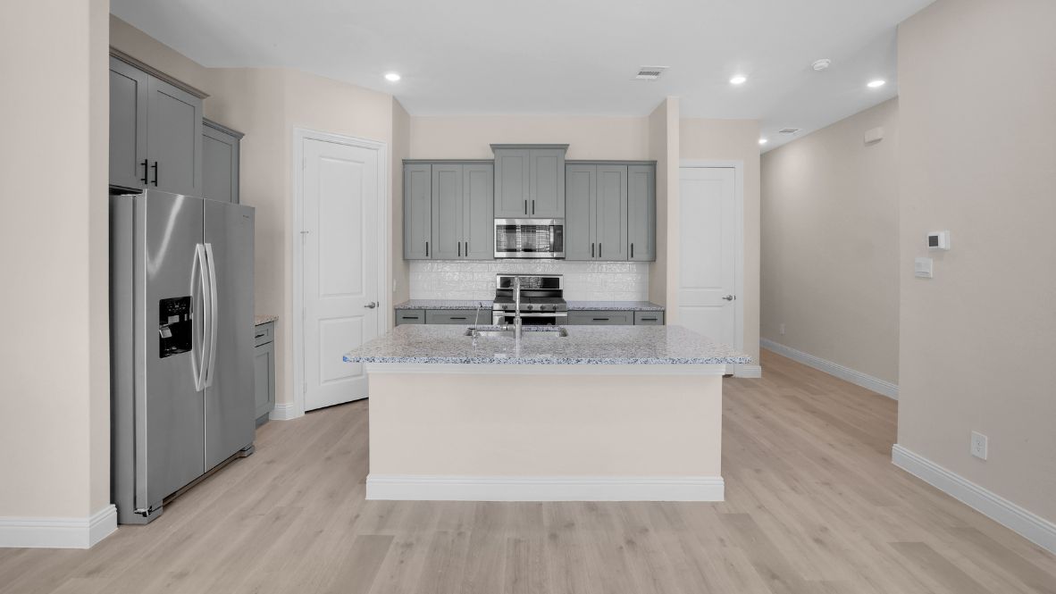 Explore the Longhorn Floor Plan at The Avenue in Allen, TX  Introducing the Longhorn, a beautifully designed 4-bedroom, 3.5-bathroom, 3-story home with 2,223 sq. ft. of spacious and modern living. The striking brick exterior, expansive windows, and sophisticated architectural details create unmatched curb appeal. Located in The Avenue, this home offers a rear-entry garage and a charming greenway-facing front, blending privacy with vibrant community living.  Step through the front door into a bright, open-concept living space, where natural light highlights the picture-frame cabinetry, stainless steel appliances, and quartz or granite countertops in the chef-inspired kitchen. The first floor features a welcoming family and dining area, along with a powder bath for guests.  On the second floor, you’ll find two spacious bedrooms, including a luxurious primary suite with a spa-like bath and large walk-in closet. The open-to-below design creates an airy, grand feel. The third floor offers two additional bedrooms and a game room, perfect for entertainment or a private retreat.  Situated in top-rated Allen ISD, this smart home has quick access to major highways. Plus, residents will enjoy a coming-soon outdoor plaza with a food hall, water features, and a container park—the ultimate place to live, work, and play!