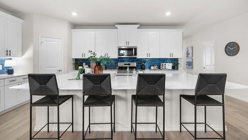 Interior kitchen with center island open to living area