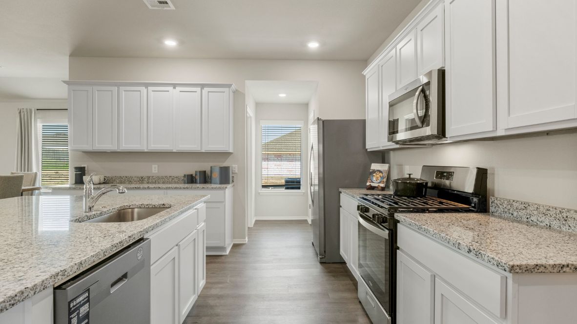 Welcome to the Kingston floor plan, the ultimate haven for large families and gracious hosts in The Brook Chase Community, nestled in the charming locale of Broken Arrow, Oklahoma. As a buyer favorite, the Kingston offers a single-story layout with 4 bedrooms, 3 baths, plus a flex room that can be tailored to your needs, boasting a spacious 2031 square feet of living space.  From the outside, admire the traditional brick or brick and rock exterior, exuding beautiful curb appeal that sets the stage for a warm welcome. Step inside to discover an open concept layout, featuring painted white shaker-style cabinets, granite countertops, and stainless steel appliances, including a gas range, creating a culinary haven that overlooks the dining area and spacious living room.  Gather with loved ones in the large central family room, adorned with an extra-large kitchen island that can easily seat up to 5 people, making it ideal for hosting gatherings or holiday celebrations.  Retreat to the comfort of the bedrooms, with plush carpeting enhancing coziness, while the main living areas and halls showcase durable luxury vinyl wood flooring, marrying style with practicality.  Indulge in the luxury of the primary suite, complete with a dual vanity, huge walk-in closet, separate water closet, and a large walk-in shower, offering a serene sanctuary for relaxation. Plus, enjoy the convenience of smart home features included in every Kingston floor plan.  Experience the epitome of gracious living in the Kingston floor plan at The Brook Chase Community. Schedule a tour today and make your dream home a reality in Broken Arrow, Oklahoma.