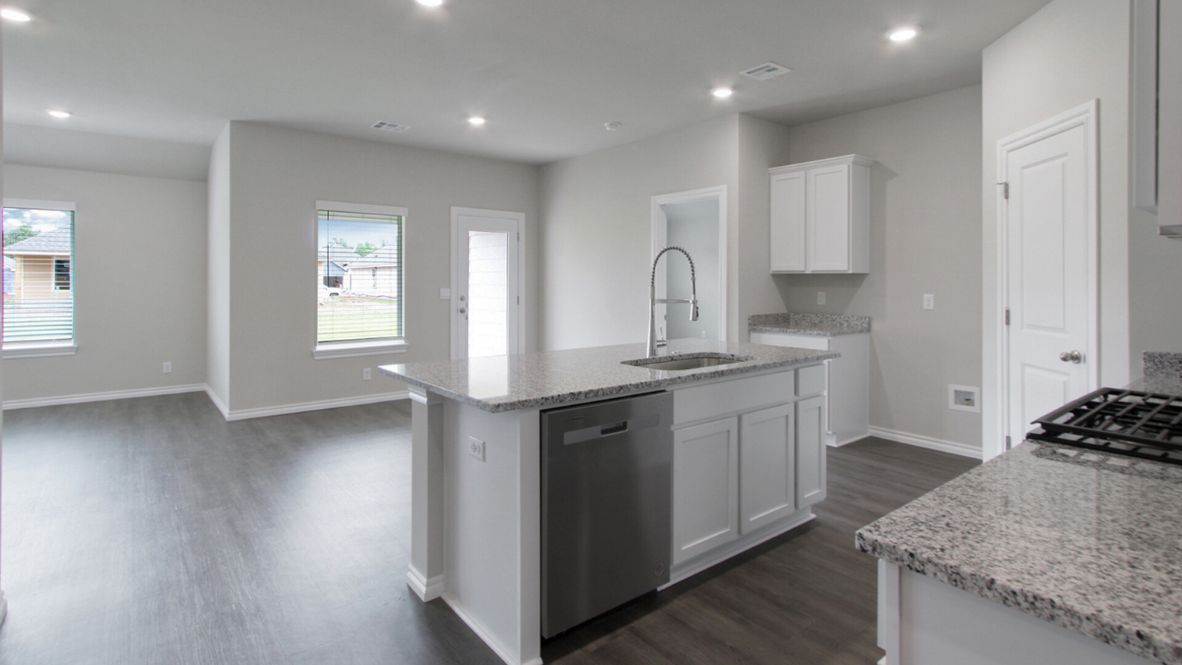 Welcome to the Denton floor plan, where modern charm meets cozy elegance in the heart of The Conrad Village Community, nestled in scenic Bixby, Oklahoma. This one-story haven offers 3 bedrooms, 2 baths, and a generous 1575 square feet of living space, perfect for those seeking a warm and inviting retreat.  From the outside, admire the traditional brick or brick and rock exterior, exuding timeless allure and modern curb appeal. Step inside to discover an open concept layout that effortlessly combines style and functionality. The kitchen features painted white shaker-style cabinets, granite countertops, and stainless steel appliances, creating a welcoming atmosphere that overlooks the dining area and living room, ideal for gatherings and entertaining.  As you explore further, you'll find comfort in every corner. Sink your feet into plush carpeting in the bedrooms, while the main living areas and halls boast durable luxury vinyl wood flooring, adding a touch of rustic charm to your everyday life. Indulge in the luxury of the primary suite, complete with a dual vanity, huge walk-in closet, separate water closet, and a large walk-in shower, ensuring your comfort and convenience.  Experience the convenience of smart home features included in every Denton floor plan. Schedule a tour today and discover your perfect blend of modern luxury and cozy warmth at The Conrad Village Community in Bixby, Oklahoma.