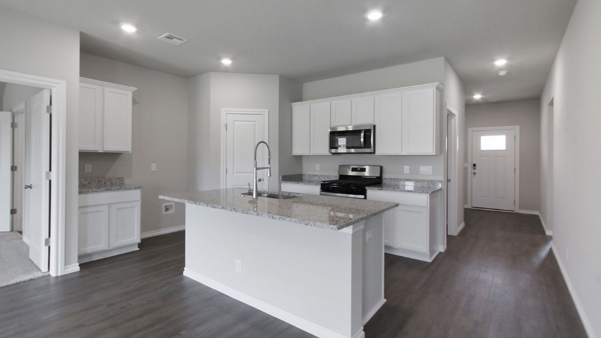 Welcome to the Denton floor plan, where modern charm meets cozy elegance in the heart of The Conrad Village Community, nestled in scenic Bixby, Oklahoma. This one-story haven offers 3 bedrooms, 2 baths, and a generous 1575 square feet of living space, perfect for those seeking a warm and inviting retreat.  From the outside, admire the traditional brick or brick and rock exterior, exuding timeless allure and modern curb appeal. Step inside to discover an open concept layout that effortlessly combines style and functionality. The kitchen features painted white shaker-style cabinets, granite countertops, and stainless steel appliances, creating a welcoming atmosphere that overlooks the dining area and living room, ideal for gatherings and entertaining.  As you explore further, you'll find comfort in every corner. Sink your feet into plush carpeting in the bedrooms, while the main living areas and halls boast durable luxury vinyl wood flooring, adding a touch of rustic charm to your everyday life. Indulge in the luxury of the primary suite, complete with a dual vanity, huge walk-in closet, separate water closet, and a large walk-in shower, ensuring your comfort and convenience.  Experience the convenience of smart home features included in every Denton floor plan. Schedule a tour today and discover your perfect blend of modern luxury and cozy warmth at The Conrad Village Community in Bixby, Oklahoma.