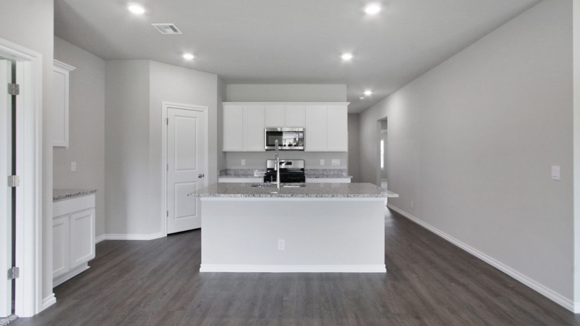 Welcome to the Denton floor plan, where modern charm meets cozy elegance in the heart of The Conrad Village Community, nestled in scenic Bixby, Oklahoma. This one-story haven offers 3 bedrooms, 2 baths, and a generous 1575 square feet of living space, perfect for those seeking a warm and inviting retreat.  From the outside, admire the traditional brick or brick and rock exterior, exuding timeless allure and modern curb appeal. Step inside to discover an open concept layout that effortlessly combines style and functionality. The kitchen features painted white shaker-style cabinets, granite countertops, and stainless steel appliances, creating a welcoming atmosphere that overlooks the dining area and living room, ideal for gatherings and entertaining.  As you explore further, you'll find comfort in every corner. Sink your feet into plush carpeting in the bedrooms, while the main living areas and halls boast durable luxury vinyl wood flooring, adding a touch of rustic charm to your everyday life. Indulge in the luxury of the primary suite, complete with a dual vanity, huge walk-in closet, separate water closet, and a large walk-in shower, ensuring your comfort and convenience.  Experience the convenience of smart home features included in every Denton floor plan. Schedule a tour today and discover your perfect blend of modern luxury and cozy warmth at The Conrad Village Community in Bixby, Oklahoma.