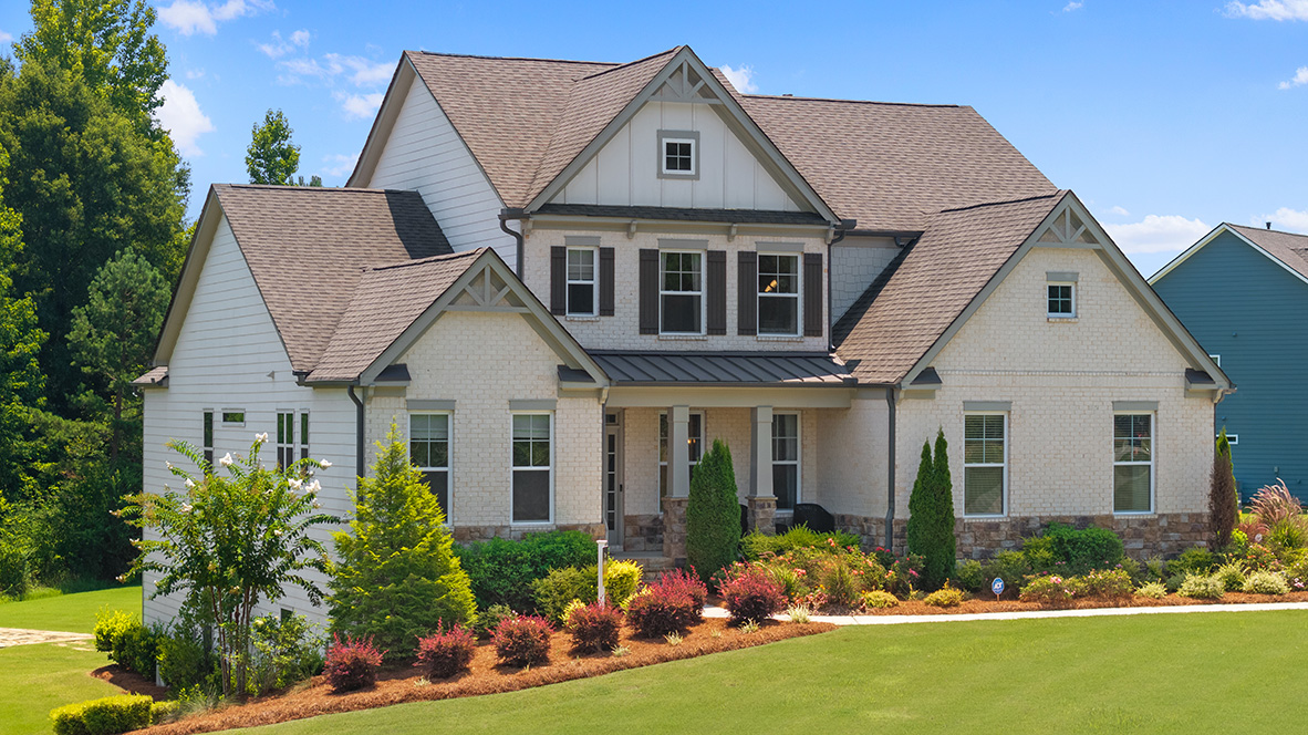 Ashley front exterior with light brick and landscaping at genesee in newnan. geoegia