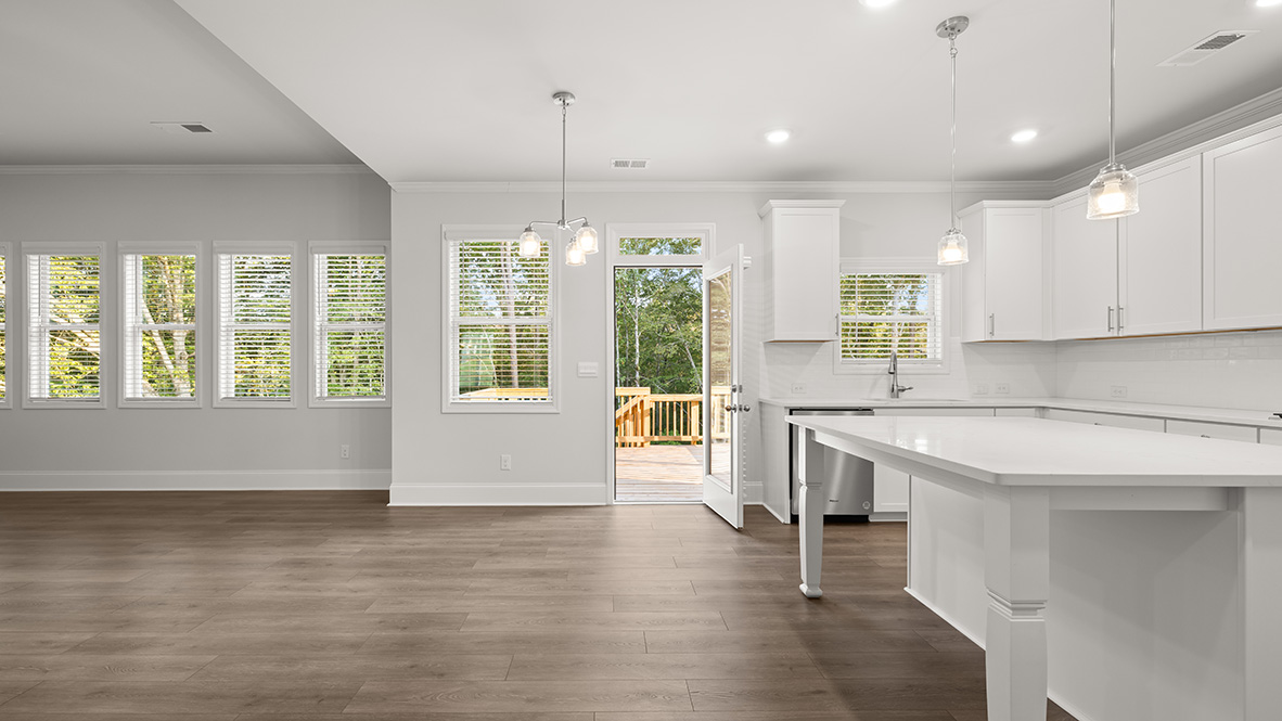 savannah II kitchen with white cabinets and granite countertops at gensee in newnan georgia