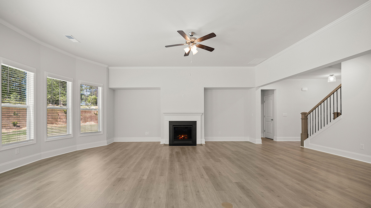 sonoma living room with fireplace and large windows at genesee in newnan georgia