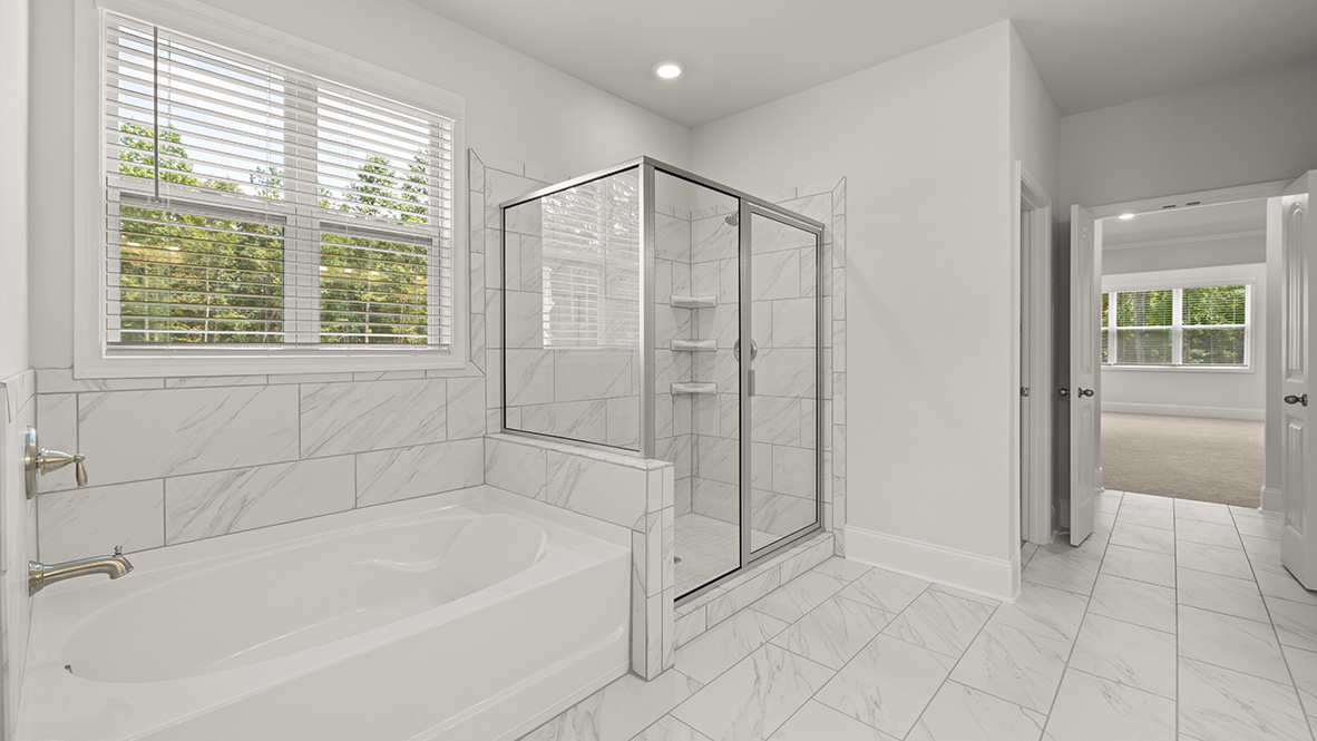 tisdale primary bathroom with separate tub and shower at genesee in newnan georgia