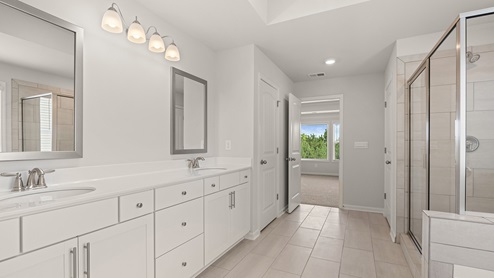 sample edinburgh primary bathroom with separate tub and shower at tributary village in douglasville georgia