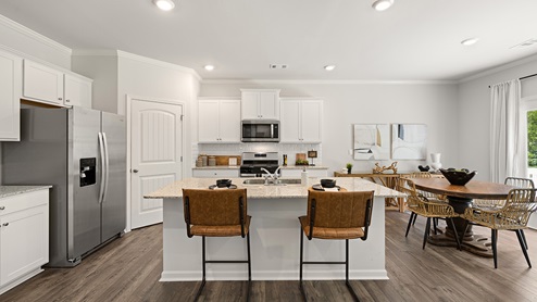 model home open kitchen with large island in the braselton village in braselton georgia