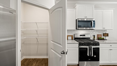 model home open kitchen with large island in the braselton village in braselton georgia