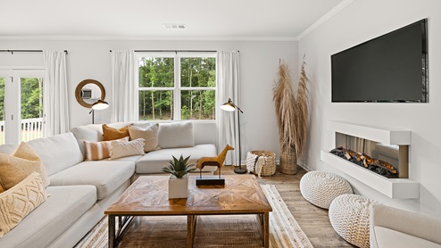 model home living room with hardwood flooring in the braselton village in braselton georgia