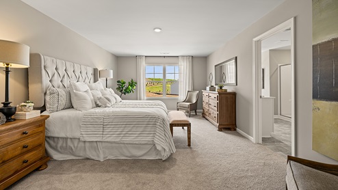 model home primary bedroom in the braselton village in braselton georgia