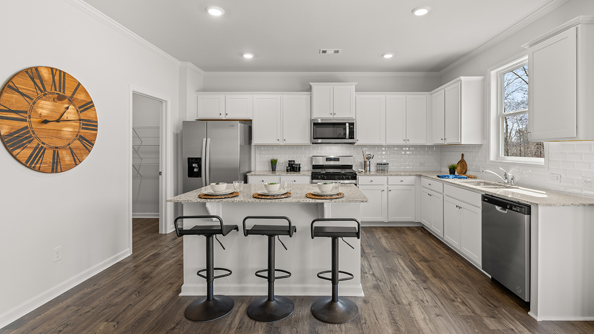 Hanover Plan kitchen in D.R. Horton home at Lost Creek with clean cabinetry lines and space for seating around island
