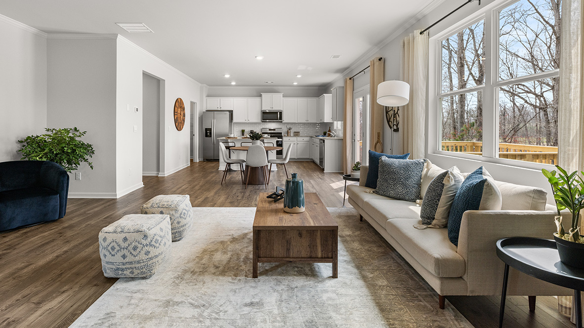 New Home kitchen inside Hanover Plan by D.R. Horton with spacious island and Fresh Open Concept layout into living room