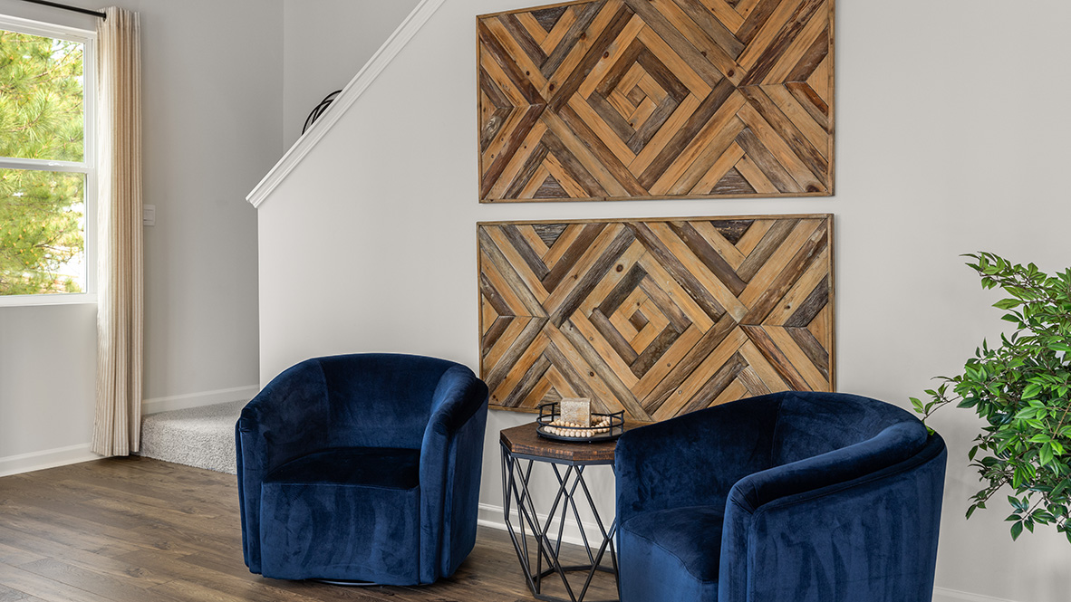 Living room in Hanover Plan showing Open Concept living area with natural light and access to backyard space in Lost Creek