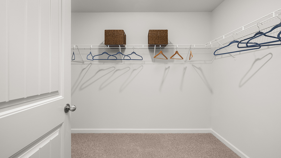 New Construction Home by D.R. Horton in Lost Creek featuring Hanover Plan primary bedroom with spacious walk in closet