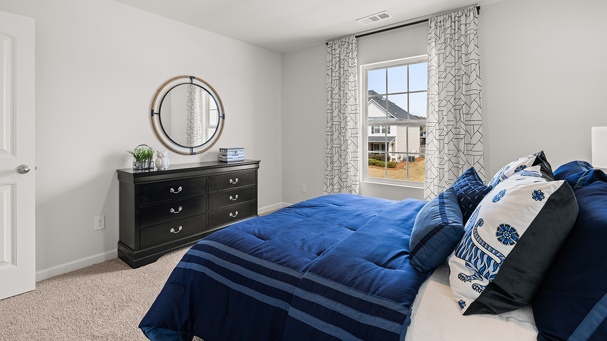 Hanover Plan secondary bedroom by D.R. Horton with functional layout and access to Jack-and-Jill bathroom in Lost Creek