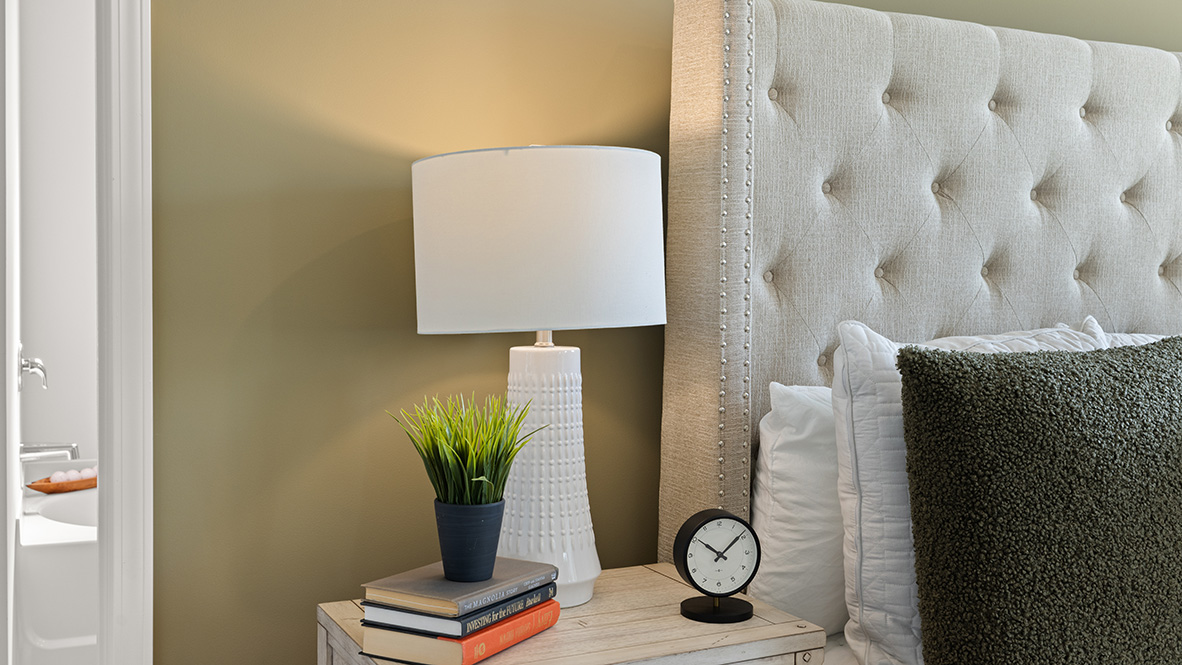 Interior primary bedroom with large windows