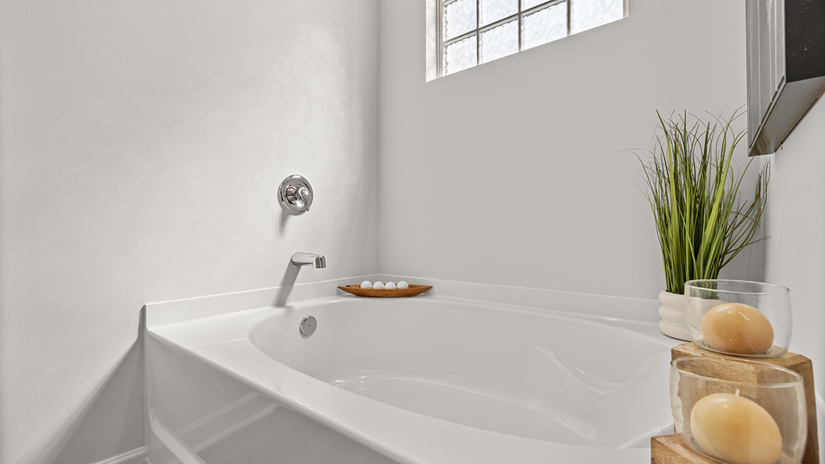 Interior primary bathroom with bath tub