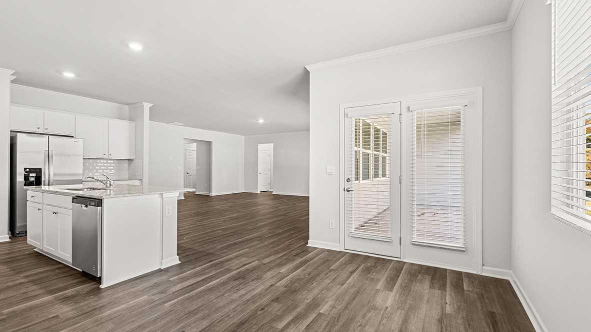 Interior kitchen with center island and white cabinets