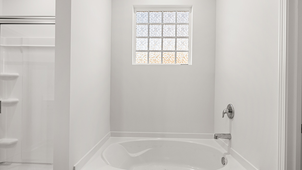 Interior primary bathroom with bath tub
