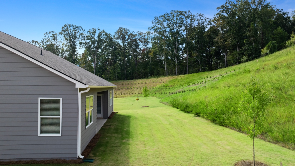 Back exterior of Denton Plan by D.R. Horton in Lost Creek Dallas Georgia with classic elevation and covered back porch