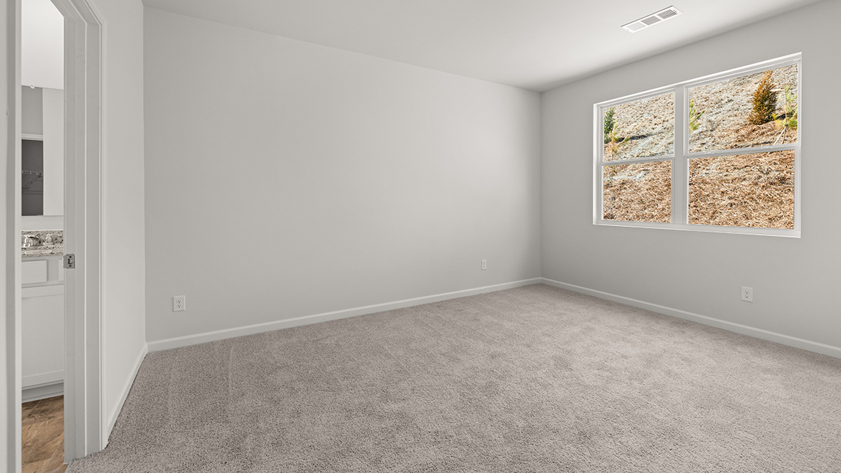 Interior primary bathroom with large window