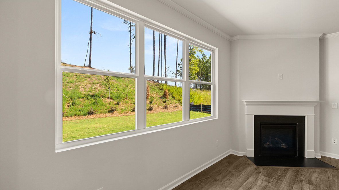 Interior living area with fire place and large windows
