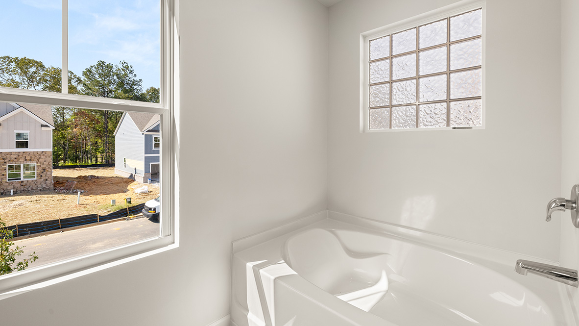 Interior primary bathroom with bath tub